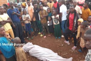 Residents including children look at the body of the alleged thief lynched in Rugombo, March 3, 2024