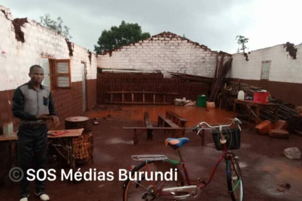 A man stands in the ruins of a house destroyed by torrential rains in Nyarugusu, October 2024 (SOS Médias Burundi)