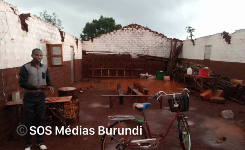 A man stands in the ruins of a house destroyed by torrential rains in Nyarugusu, October 2024 (SOS Médias Burundi)