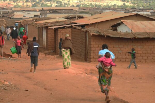 People walk inside Dzaleka camp in Dowa district in the central region of Malawi on June 20, 2018, DR