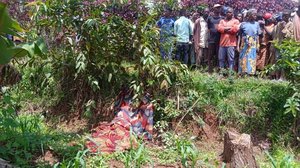 Residents at the site of the discovery of the body of Gloriose Ruranditse, DR